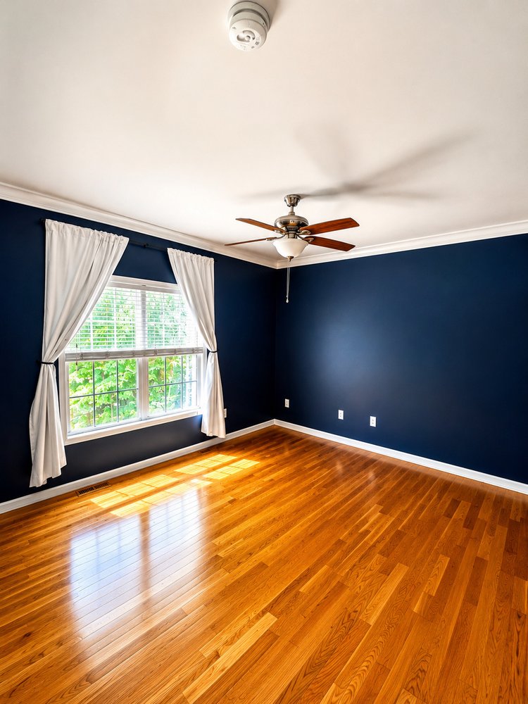 Bedroom with polished hardwood floors after a deep cleaning
