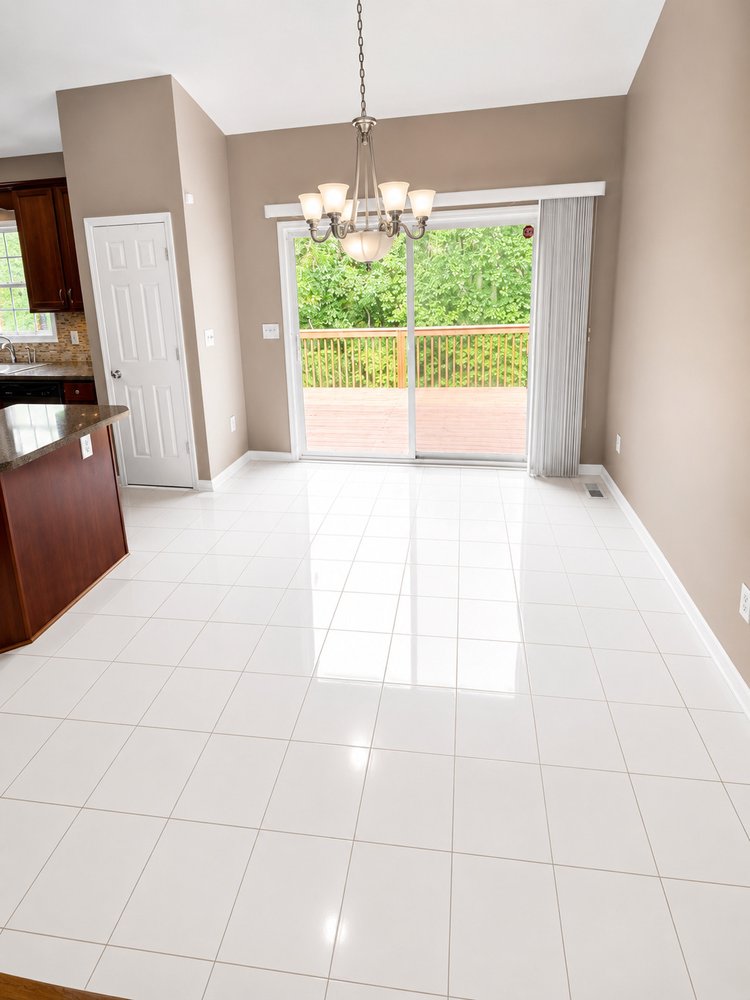 Gleaming tile floors and empty room after a thorough move-out cleaning